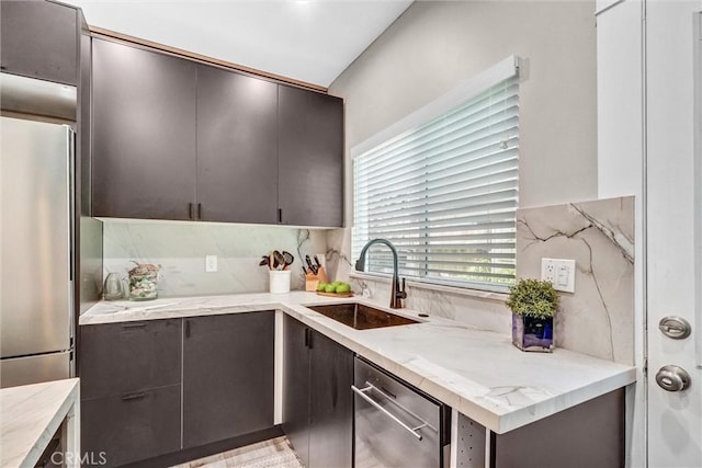 1616 E Ocean Blvd Unit 6, Long Beach, CA 90802 - kitchen with stainless steel appliances, light stone counters, modern cabinets, and dark brown cabinetry