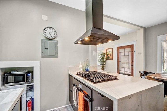 1616 E Ocean Blvd Unit 6, Long Beach, CA 90802 - kitchen with wall chimney exhaust hood, electric panel, stainless steel microwave, and light stone countertops