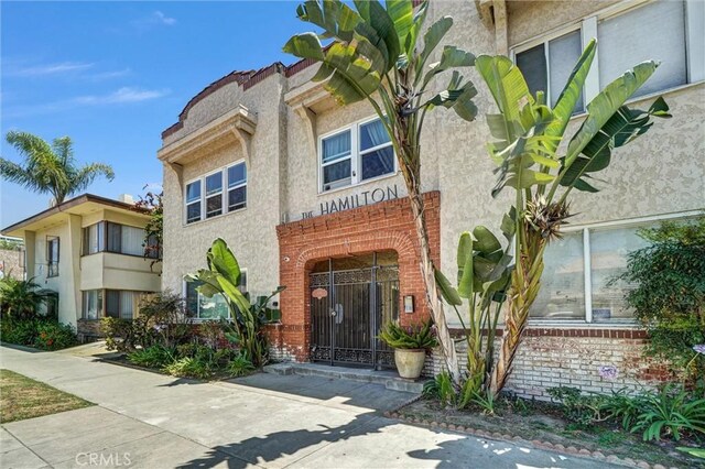 1616 E Ocean Blvd Unit 6, Long Beach, CA 90802 - doorway to property with stucco siding