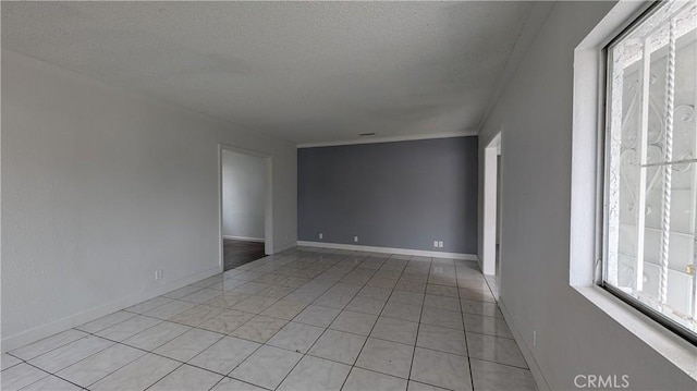 9614 Graham Ave, Los Angeles, CA 90002 - unfurnished room with a textured ceiling and light tile patterned floors