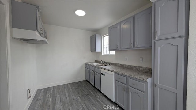 9614 Graham Ave, Los Angeles, CA 90002 - kitchen featuring white dishwasher, dark wood-style flooring, and gray cabinetry
