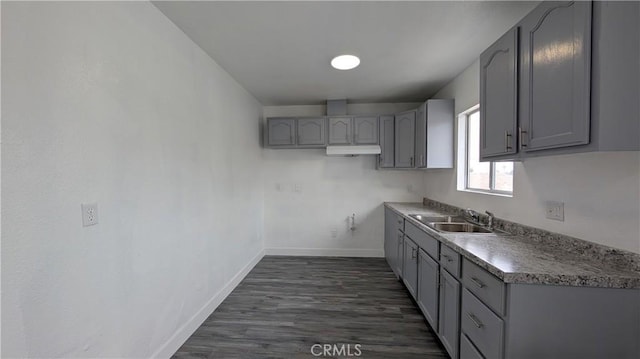 9614 Graham Ave, Los Angeles, CA 90002 - kitchen with gray cabinets and dark wood finished floors