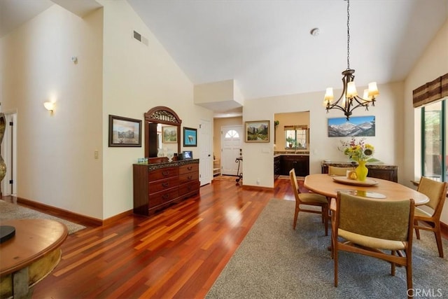 6271 Twinberry Cir Unit 6, Avila Beach, CA 93424 - dining space with high vaulted ceiling, a chandelier, and wood finished floors