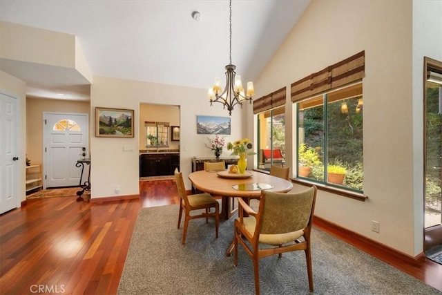 6271 Twinberry Cir Unit 6, Avila Beach, CA 93424 - dining area with a chandelier, healthy amount of natural light, wood finished floors, and vaulted ceiling