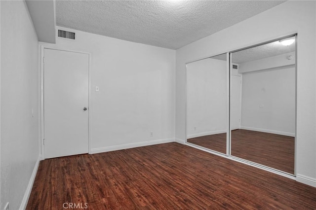 218 E Tamarack Ave Unit 5, Inglewood, CA 90301 - unfurnished bedroom with a textured ceiling, wood finished floors, and a closet