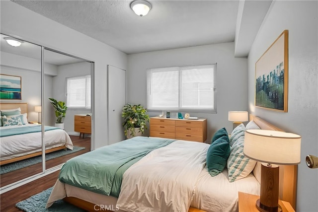 218 E Tamarack Ave Unit 5, Inglewood, CA 90301 - bedroom with wood finished floors, multiple windows, and two closets