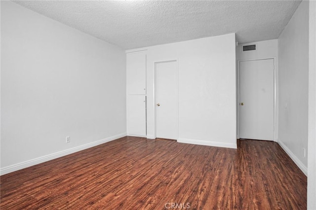 218 E Tamarack Ave Unit 5, Inglewood, CA 90301 - unfurnished bedroom with wood finished floors, a textured ceiling, and a closet