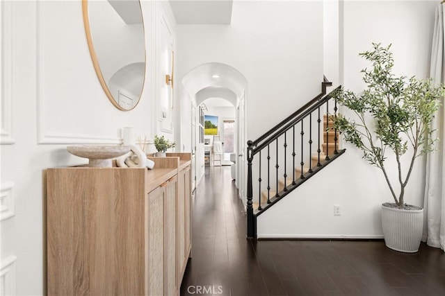 1474 De La Vina St, Chula Vista, CA 91913 - foyer featuring dark wood-style floors, arched walkways, and stairs