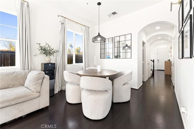 1474 De La Vina St, Chula Vista, CA 91913 - dining area with dark wood-type flooring, arched walkways, and recessed lighting