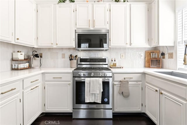 1474 De La Vina St, Chula Vista, CA 91913 - kitchen featuring stainless steel appliances, white cabinetry, light countertops, and tasteful backsplash