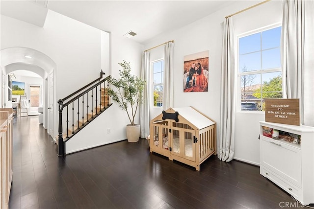 1474 De La Vina St, Chula Vista, CA 91913 - foyer featuring healthy amount of natural light, dark wood-style flooring, arched walkways, and stairway