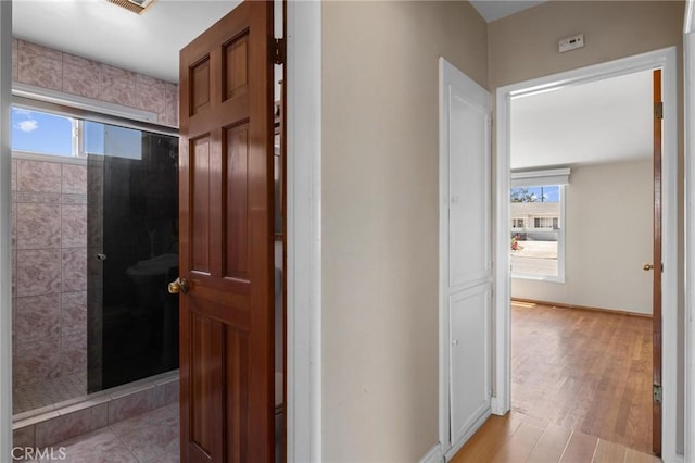 15511 Gramercy Pl, Gardena, CA 90249 - corridor with plenty of natural light and light wood-type flooring