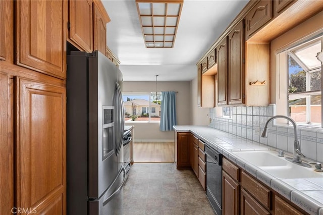 15511 Gramercy Pl, Gardena, CA 90249 - kitchen featuring stainless steel fridge with ice dispenser, tile countertops, dishwashing machine, decorative backsplash, and brown cabinetry
