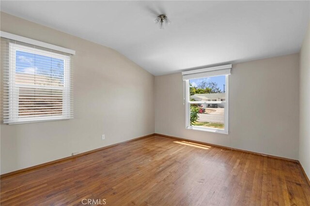 15511 Gramercy Pl, Gardena, CA 90249 - unfurnished room featuring wood finished floors and vaulted ceiling