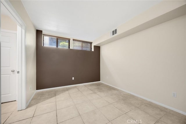 1565 Ledgestone Ln, Pomona, CA 91767 - empty room featuring tile patterned floors and baseboards