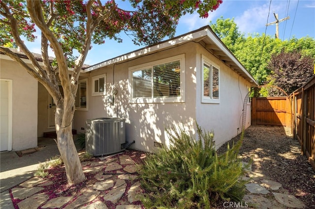 1245 Palm Ave, Chico, CA 95926 - view of property exterior with a fenced backyard, stucco siding, and crawl space