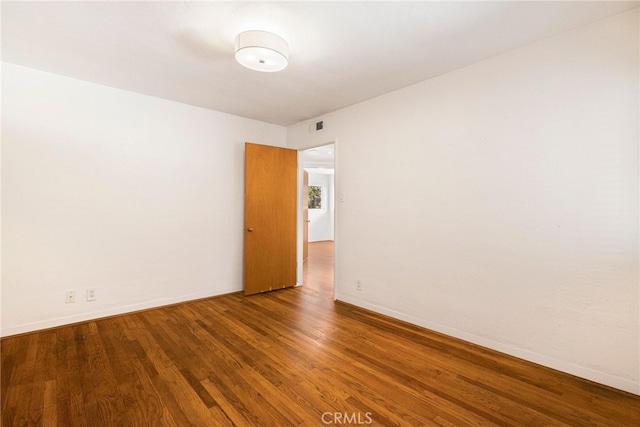 1245 Palm Ave, Chico, CA 95926 - spare room with wood finished floors and baseboards