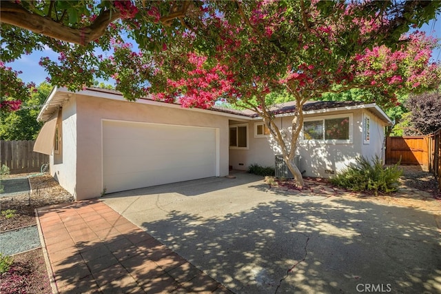 1245 Palm Ave, Chico, CA 95926 - single story home featuring driveway, a garage, stucco siding, and crawl space