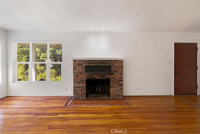 1245 Palm Ave, Chico, CA 95926 - unfurnished living room featuring wood finished floors, a fireplace, and recessed lighting
