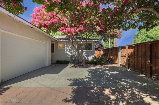 1245 Palm Ave, Chico, CA 95926 - view of patio / terrace featuring concrete driveway and an attached garage