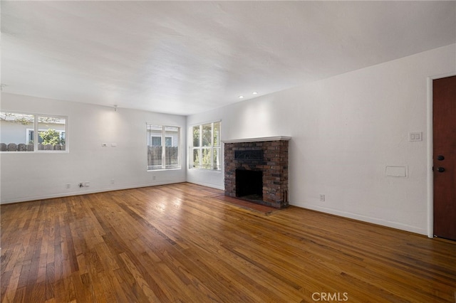 1245 Palm Ave, Chico, CA 95926 - unfurnished living room with wood-type flooring and a fireplace