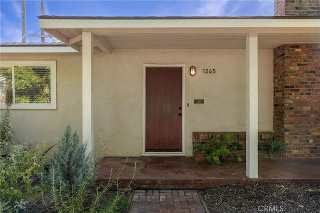 1245 Palm Ave, Chico, CA 95926 - entrance to property with stucco siding and a chimney