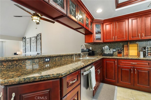 810 Baker St Unit 210, Costa Mesa, CA 92626 - kitchen with reddish brown cabinets, dishwasher, ceiling fan, backsplash, and lofted ceiling