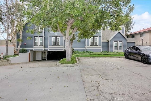 810 Baker St Unit 210, Costa Mesa, CA 92626 - view of front of property featuring uncovered parking