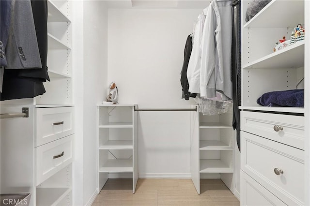 810 Baker St Unit 210, Costa Mesa, CA 92626 - walk in closet featuring light wood-style flooring