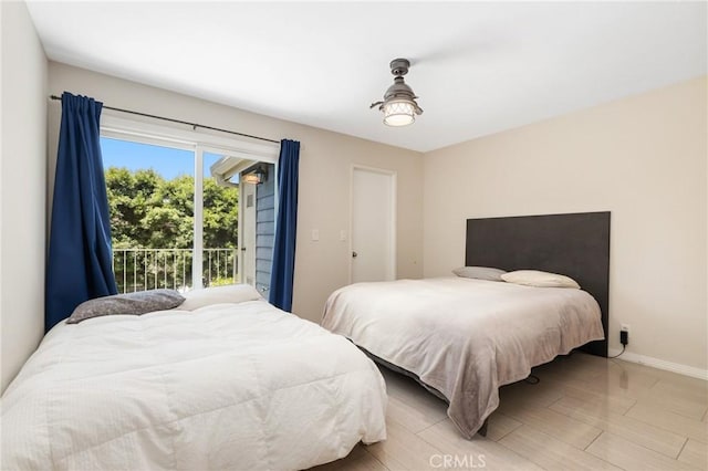 810 Baker St Unit 210, Costa Mesa, CA 92626 - bedroom featuring baseboards and light wood finished floors