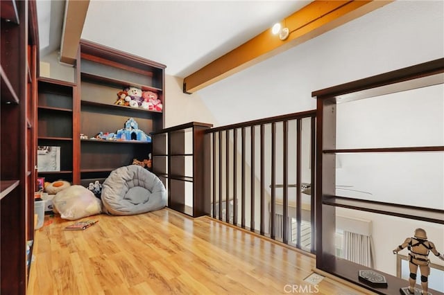 810 Baker St Unit 210, Costa Mesa, CA 92626 - sitting room with wood finished floors and beamed ceiling