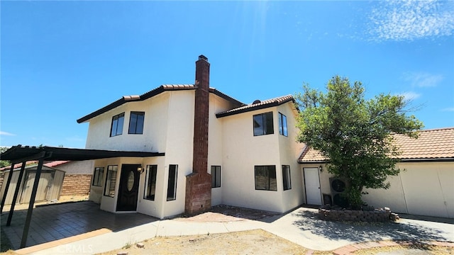 1122 W Galway St, Rialto, CA 92377 - view of front of home with a storage unit, a tiled roof, and stucco siding