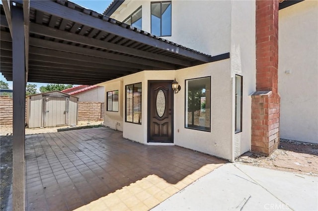 1122 W Galway St, Rialto, CA 92377 - doorway to property featuring stucco siding and a patio area