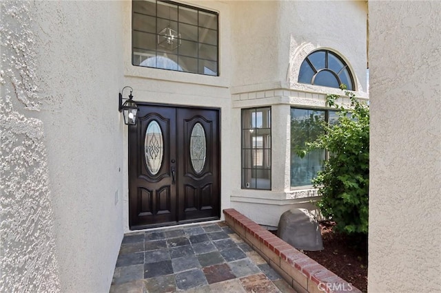 1122 W Galway St, Rialto, CA 92377 - entrance to property featuring stucco siding