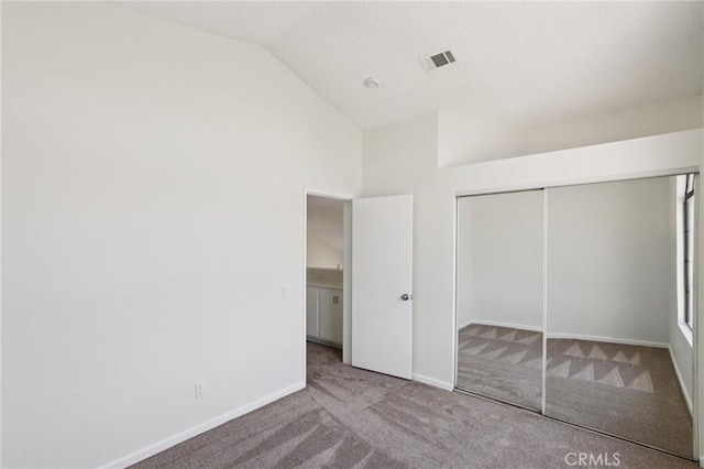 1122 W Galway St, Rialto, CA 92377 - unfurnished bedroom with lofted ceiling, carpet floors, and a closet