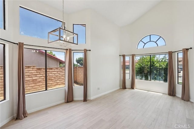 1122 W Galway St, Rialto, CA 92377 - unfurnished sunroom featuring a chandelier