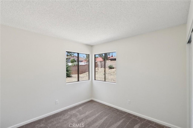 1122 W Galway St, Rialto, CA 92377 - spare room featuring dark carpet and a textured ceiling