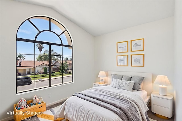 1122 W Galway St, Rialto, CA 92377 - bedroom featuring lofted ceiling and baseboards