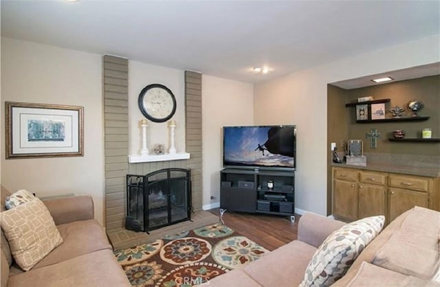 25491 2nd St, Lake Forest, CA 92630 - living area featuring a brick fireplace and dark wood finished floors