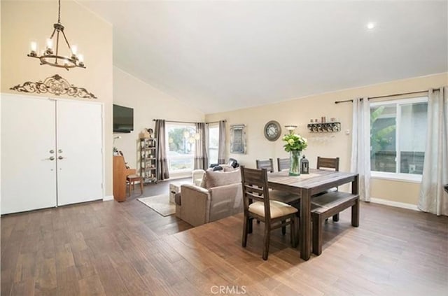 25491 2nd St, Lake Forest, CA 92630 - dining area with a chandelier, wood finished floors, healthy amount of natural light, and high vaulted ceiling