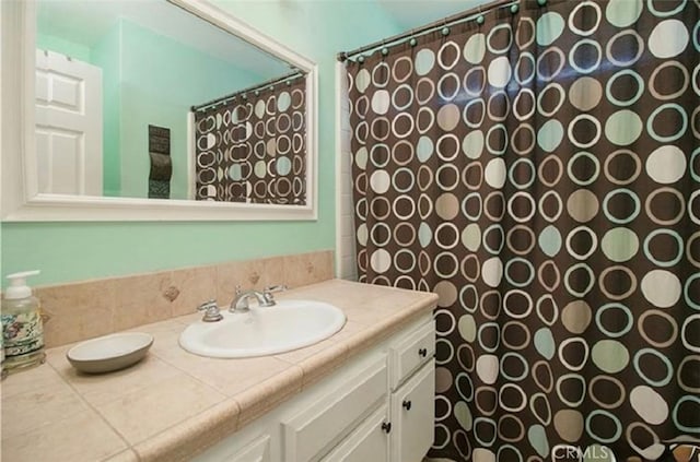 25491 2nd St, Lake Forest, CA 92630 - bathroom with vanity and a shower with shower curtain