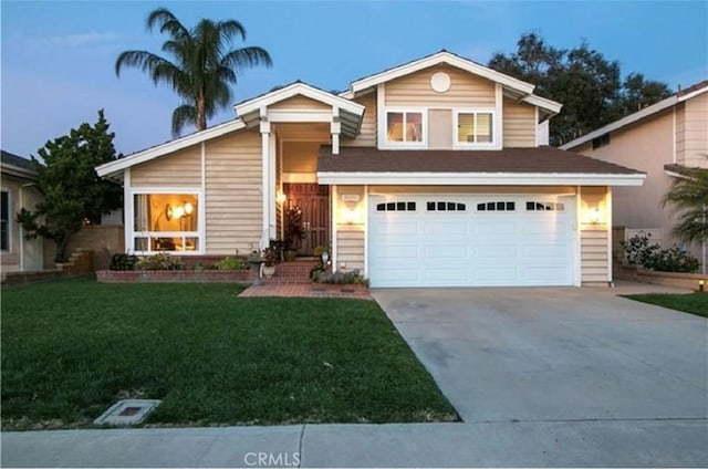 25491 2nd St, Lake Forest, CA 92630 - view of front facade featuring driveway, an attached garage, and a front yard