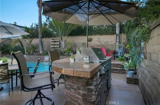 25491 2nd St, Lake Forest, CA 92630 - fenced backyard with an outdoor kitchen and a patio area