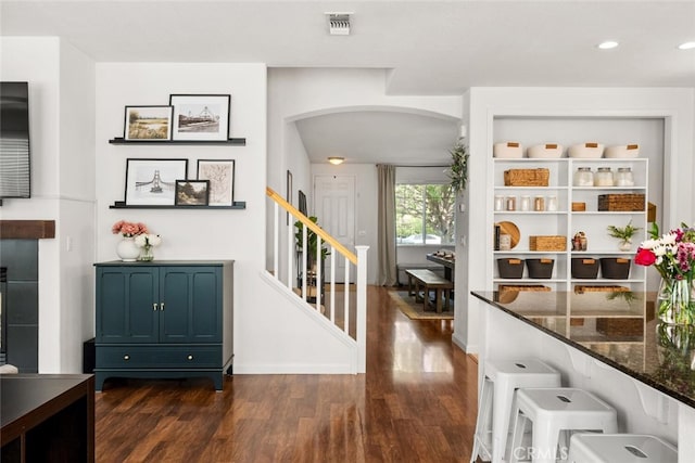 3192 Sawyers Bar Ln, Chico, CA 95973 - entrance foyer featuring arched walkways, dark wood finished floors, stairs, and recessed lighting