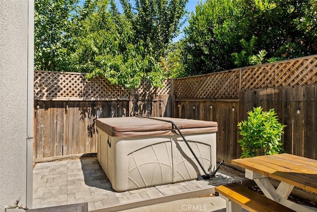 3192 Sawyers Bar Ln, Chico, CA 95973 - wooden terrace with a hot tub, a fenced backyard, and a patio area