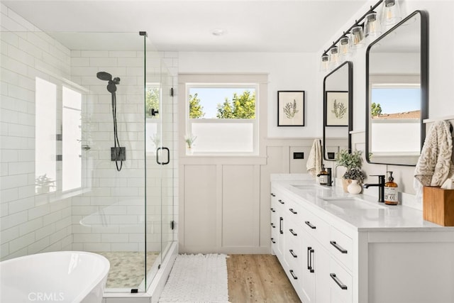 3192 Sawyers Bar Ln, Chico, CA 95973 - full bathroom with a stall shower, a freestanding bath, healthy amount of natural light, double vanity, and a wainscoted wall