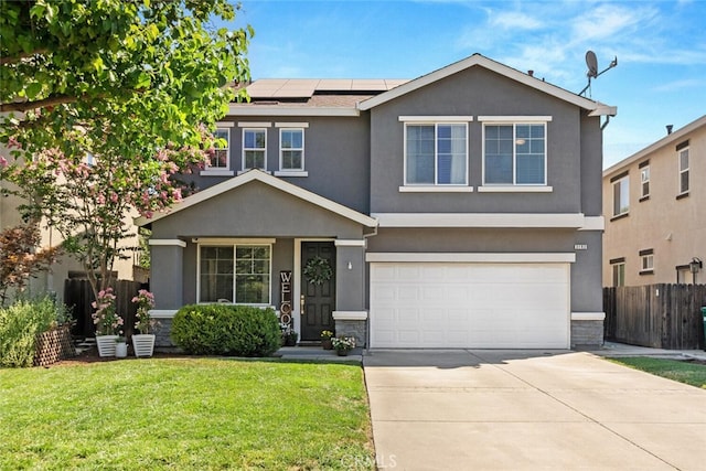3192 Sawyers Bar Ln, Chico, CA 95973 - traditional-style house featuring roof mounted solar panels, stucco siding, a garage, and concrete driveway