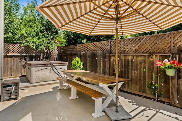 3192 Sawyers Bar Ln, Chico, CA 95973 - fenced backyard featuring a patio, outdoor dining area, and a hot tub