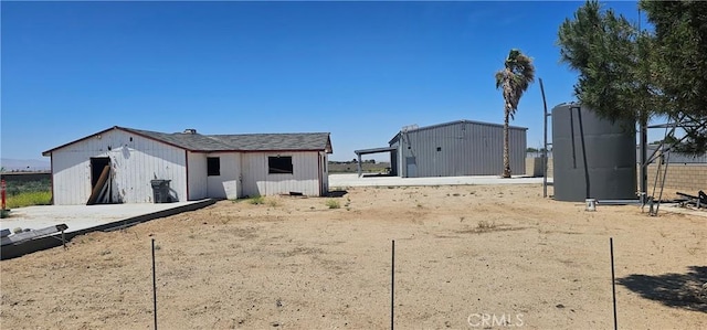45219 12th St, Lancaster, CA 93535 - rear view of property featuring an outbuilding