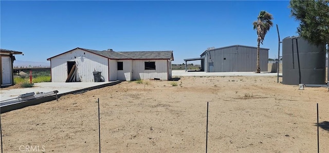 45219 12th St, Lancaster, CA 93535 - back of house with an outdoor structure